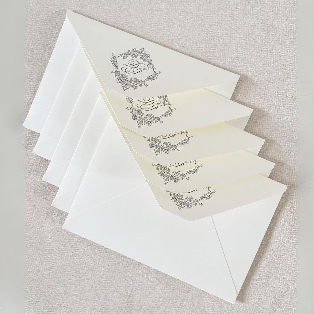 A 5x7 green envelope with a wax seal is placed in a cream-colored, sturdy envelope with self-adhesive tape.