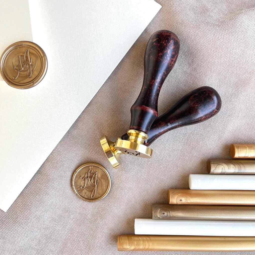 Two high-quality wax seal stamps with smooth wooden handles and precision-engraved custom initials.